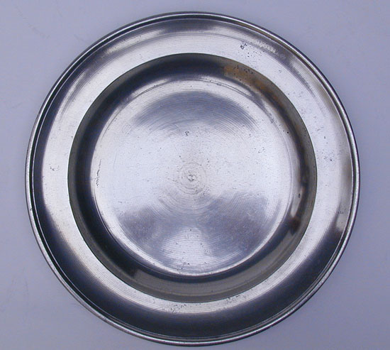 A Stephen Barnes Single Reed Rim Pewter Plate