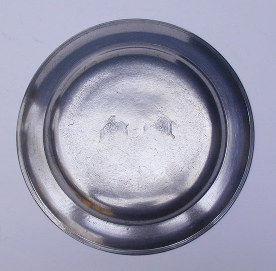 A Stephen Barnes Single Reed Rim Pewter Plate