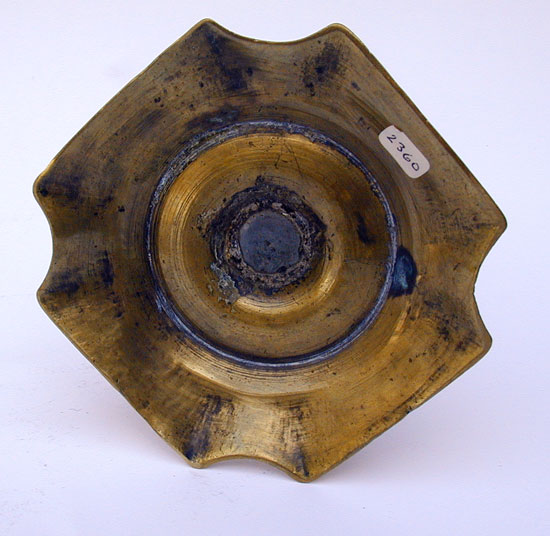 A Mid 18th Century English Push Up Brass Candlestick