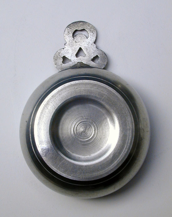 A Pewter Porringer with Heart and Crescent Moon Handle